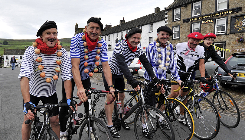 Cycling enthusiasts dressed as onion sellers ahead of stage one of the Tour de France