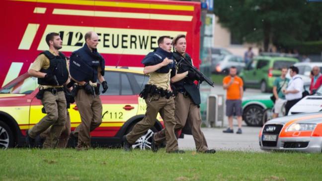 Policemen arrive at a shopping centre in which a shooting was reported in Munich, southern Germany (Matthias Balk/dpa via AP)