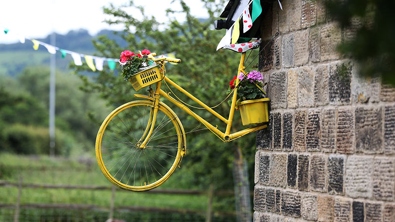 Yellow bike mounted on wall