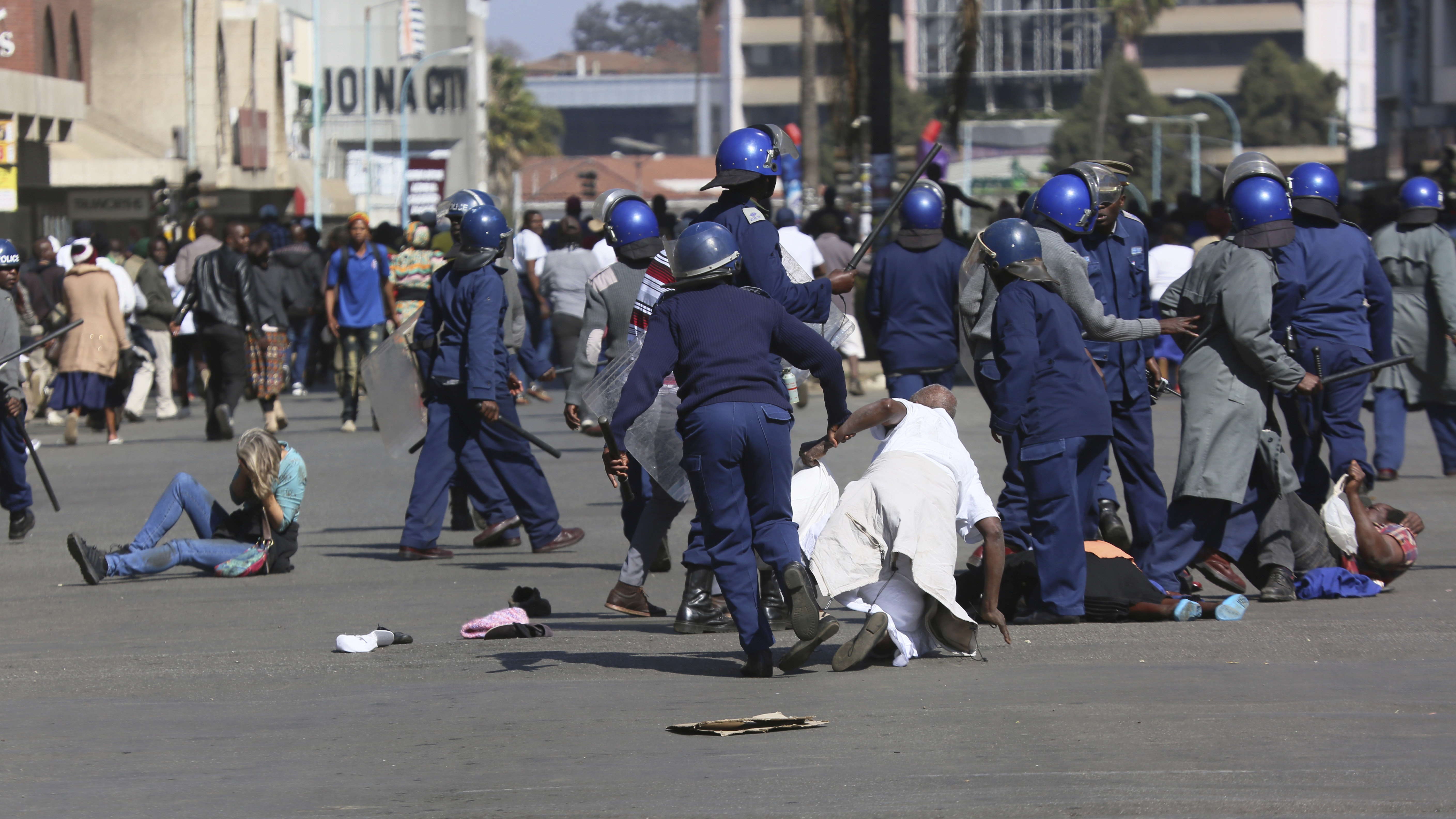 Zimbabwe police use batons to break up anti-government protest