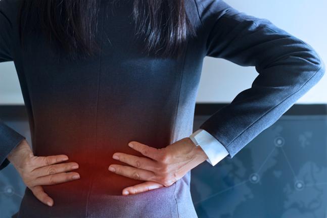 Woman rubbing back with graphic of back pain